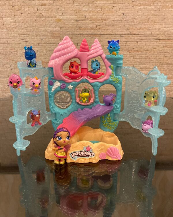 Hatchimals CollEGGtibles, Coral Castle Fold Open Playset with 11 Hatchimals and a Doll